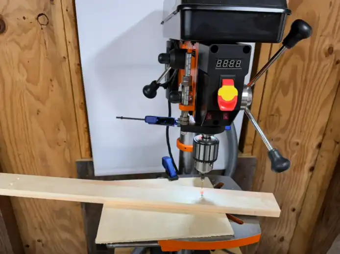 Pre-drilling screw holes with a drill press